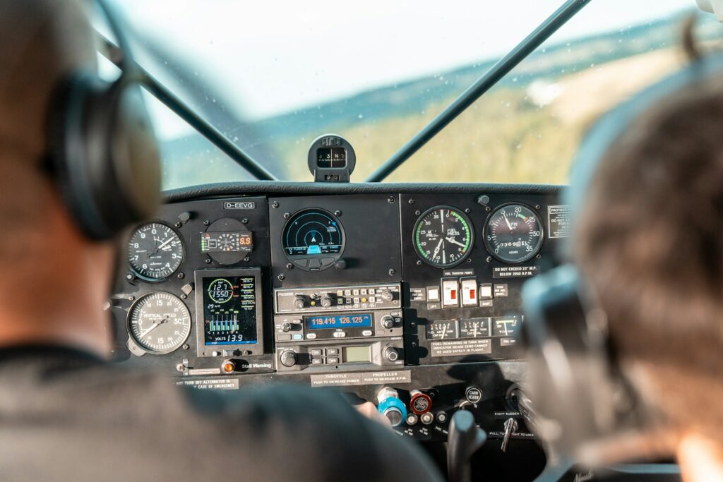 Pilots preparing for ICAO English Proficiency Test in cockpit